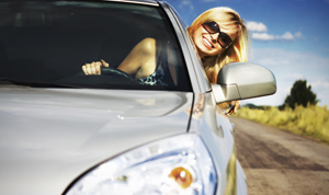 Woman driving new car